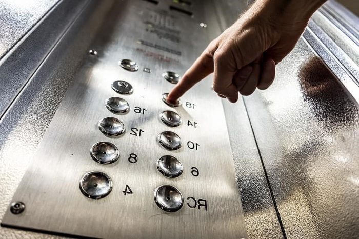 Figure 27 Pressing an elevator push button