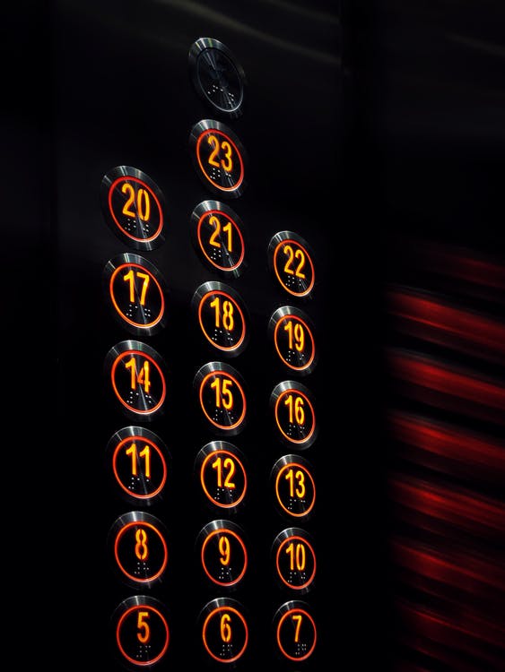 Illuminated push button switch application on elevator buttons