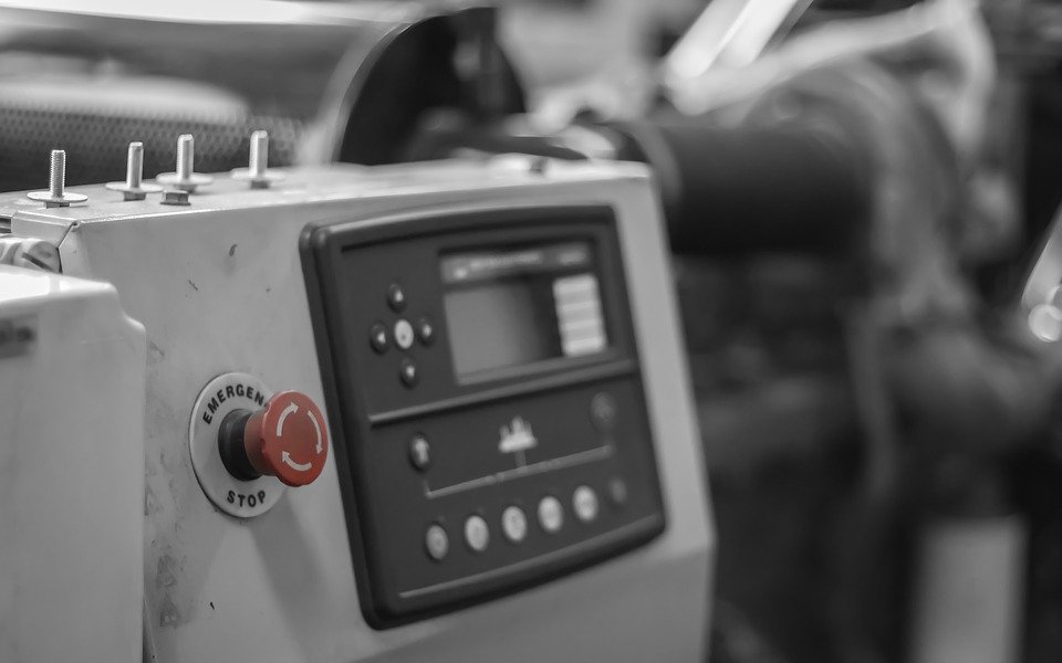 An old emergency stop push button in a factory