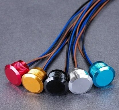 Anodized aluminum piezo switches